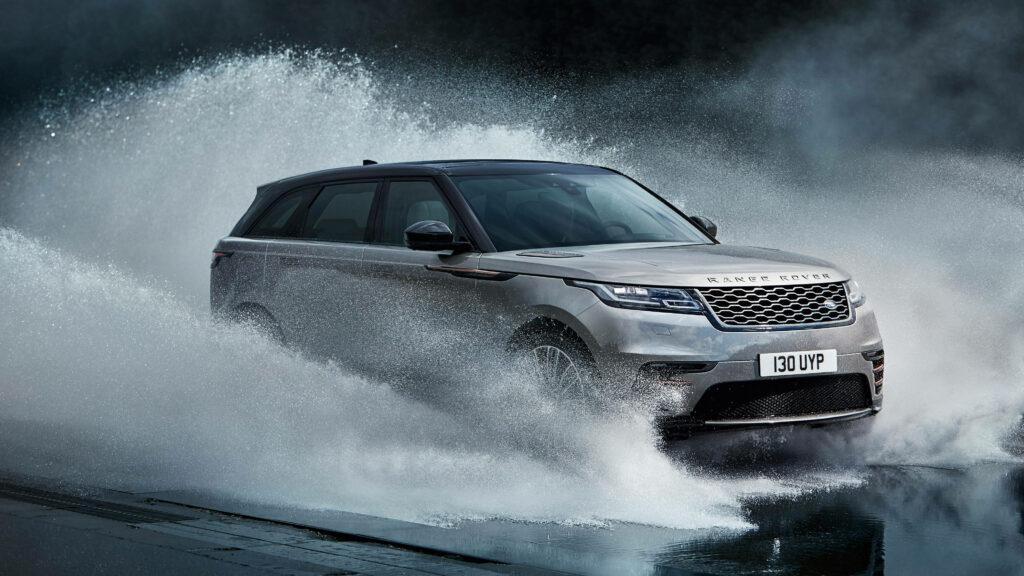 Dynamic Range Rover Velar: Luxury SUV Splash Wallpaper Background