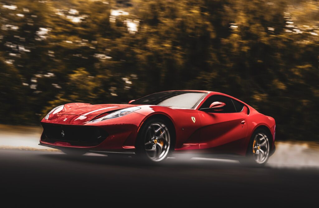 Dynamic Red Ferrari Wallpaper: Speed & Elegance in Motion