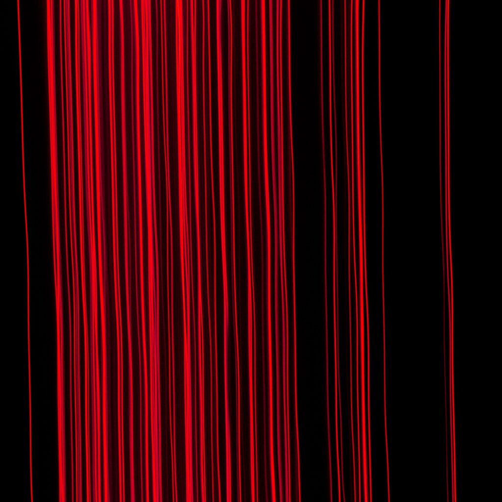 Vivid Red Glowing Lines on Dark Background - Dynamic Wallpaper