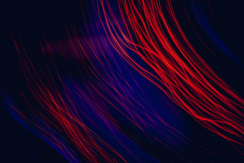 Dynamic Red Light Abstract Wallpaper on Dark Background