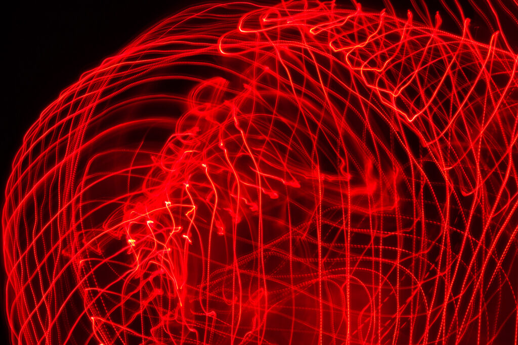 Dynamic Red Light Trails: Captivating Abstract Wallpaper Design