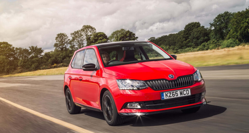Vibrant Red Skoda Fabia Wallpaper: Stylish Design & Performance Background