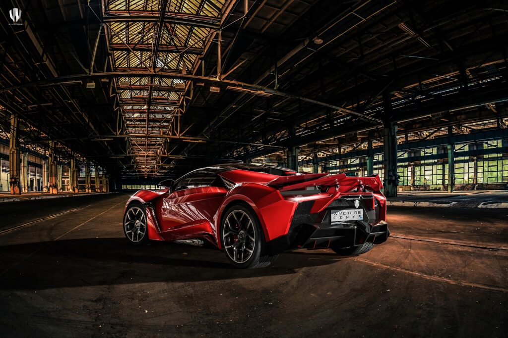 Red Sports Car Wallpaper: Bold Design in Industrial Setting