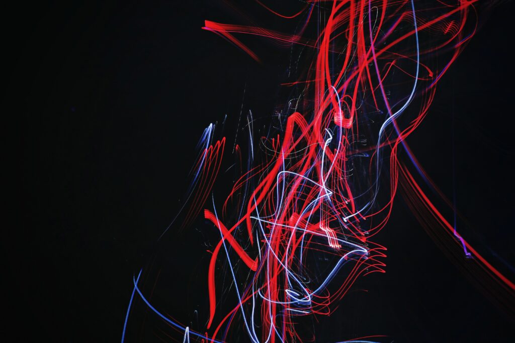 Dynamic Red & White Light Lines Wallpaper on Dark Background
