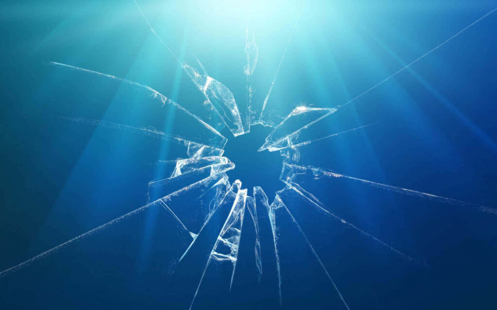 Dynamic shattered glass background with sharp cracks and vibrant blue light rays wallpaper effect