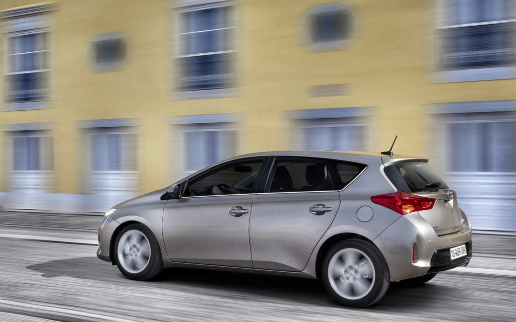Dynamic Silver Toyota Hatchback Wallpaper: Urban Speed & Style