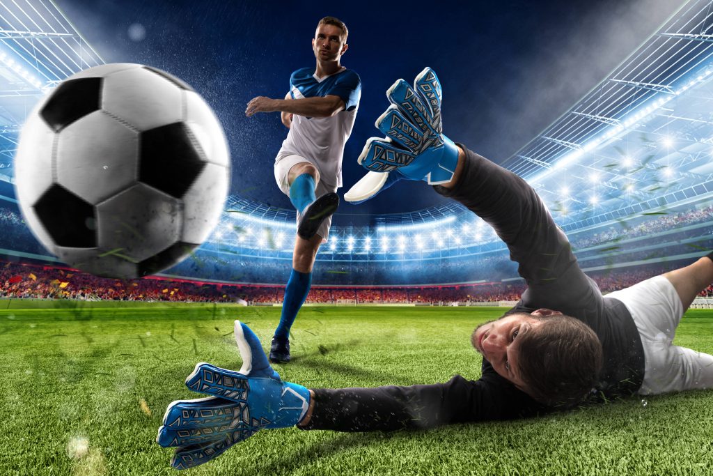 Goalkeeper diving to save a shot in vibrant stadium soccer CGI wallpaper background scene