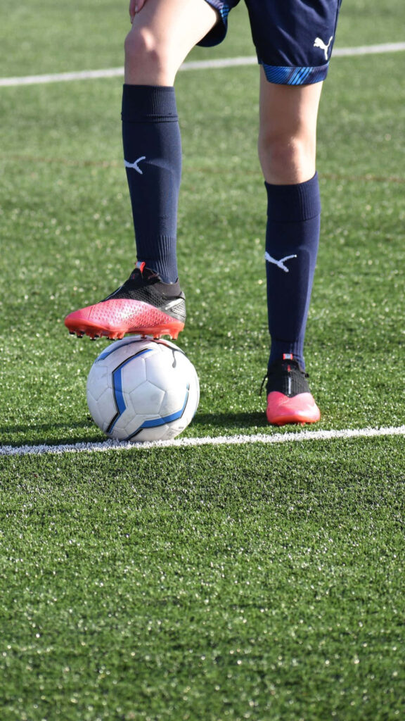 Dynamic Soccer Wallpaper: Player in Action on Field