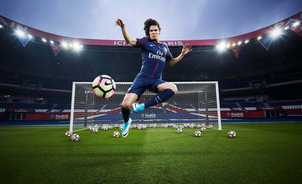 Dynamic Soccer Player Mid-Air | Vibrant Sports Wallpaper Background