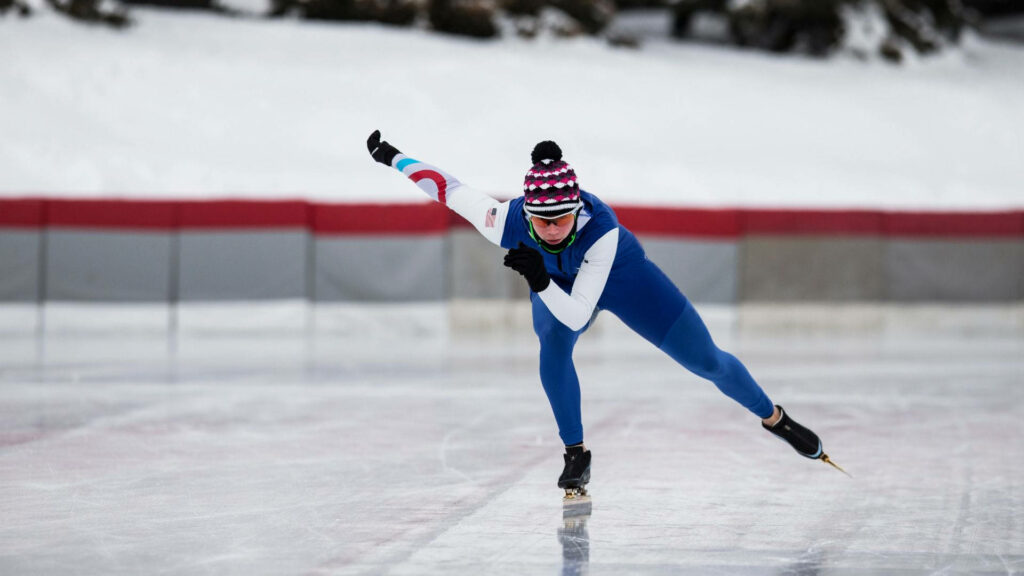 Dynamic Speed Skater Wallpaper - Precision & Intensity on Ice