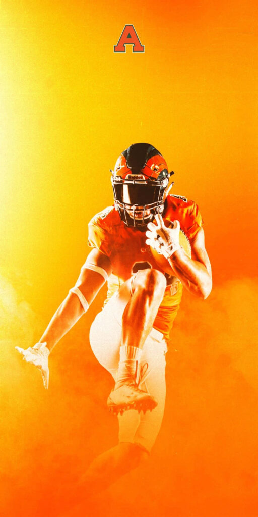 Vibrant Sports Wallpaper: Athlete in Motion on Orange Background
