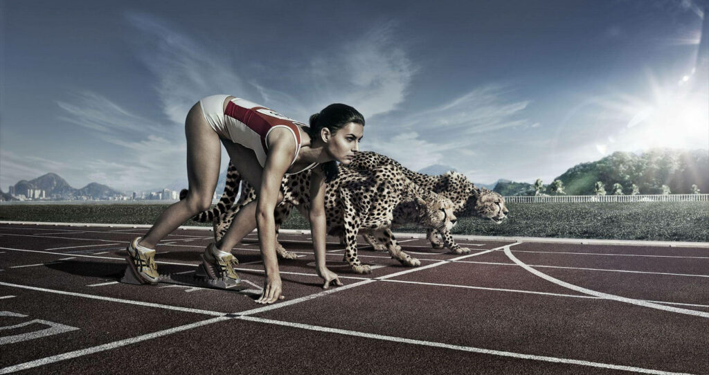 Dynamic Sports Wallpaper: Woman in Racing Stance with Leopards
