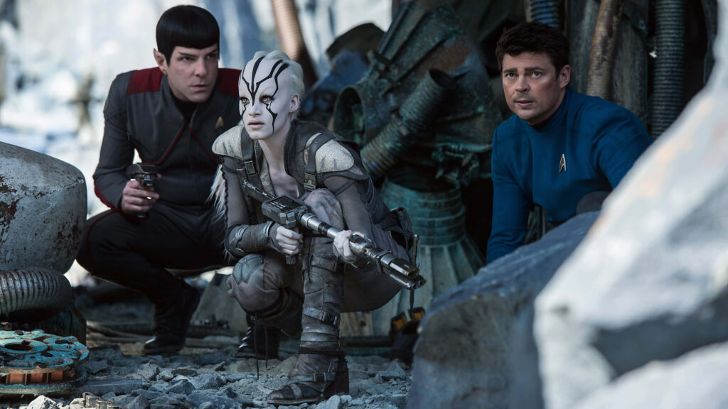 Tense Star Trek Wallpaper: Iconic Characters in Futuristic Setting