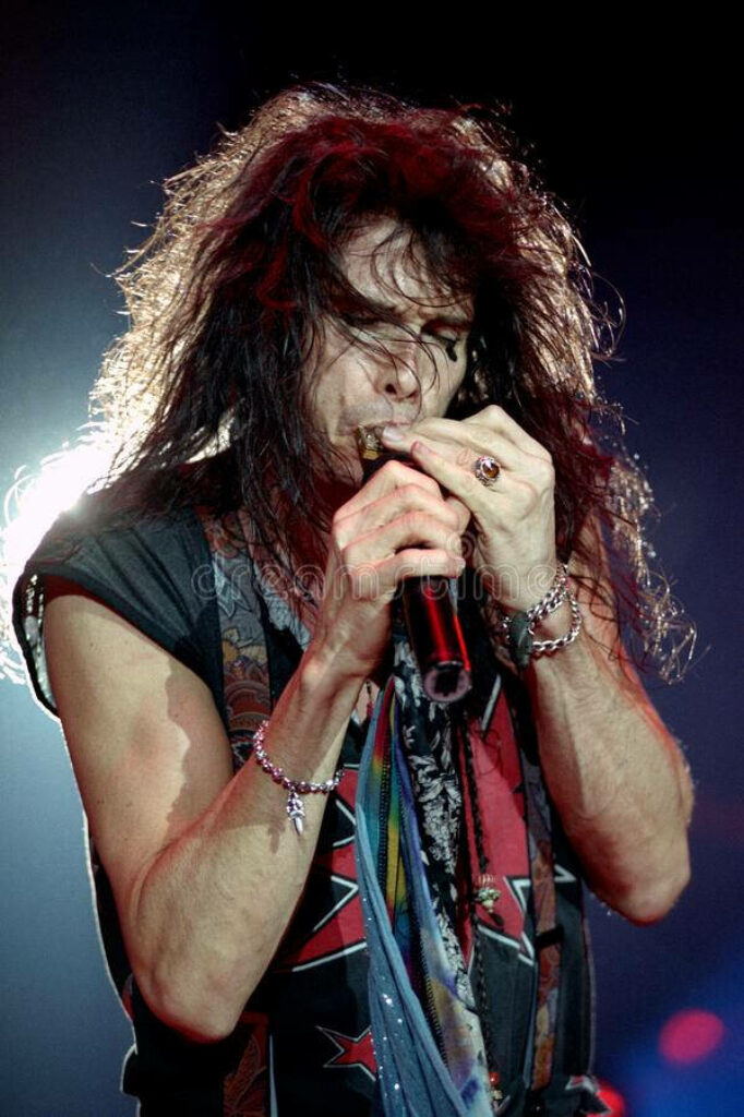 Dynamic Aerosmith Wallpaper: Steven Tyler's Passionate Stage Performance