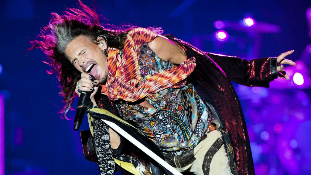 Vibrant Steven Tyler Wallpaper: Iconic Aeromith Performance Background