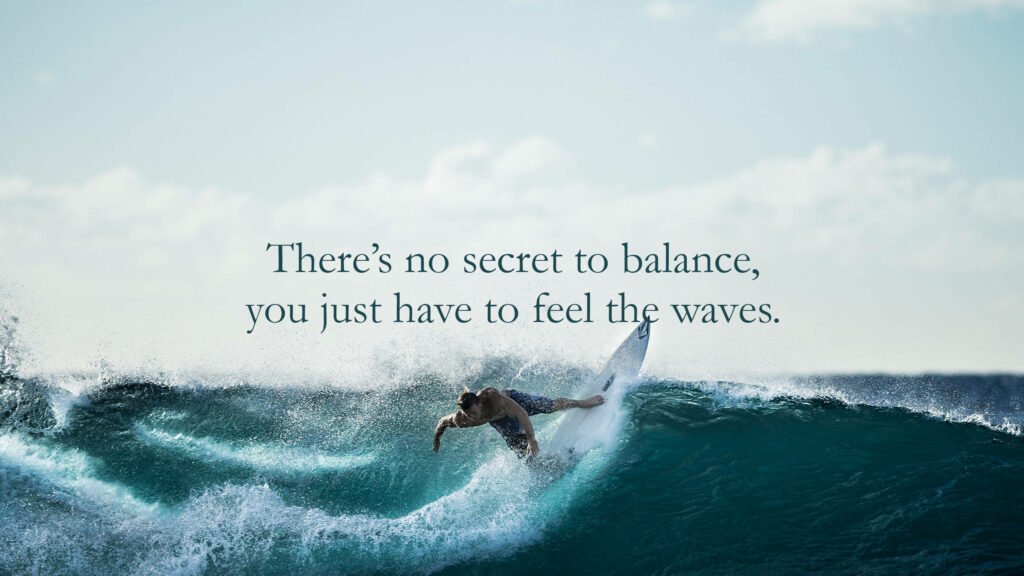 Surfer Riding Waves: Dynamic Ocean Wallpaper with Inspiring Quote