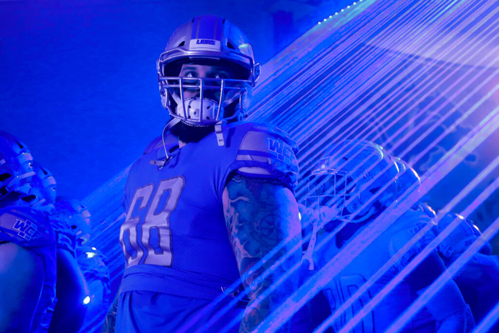 Electrifying Taylor Decker Wallpaper in Detroit Lions Uniform