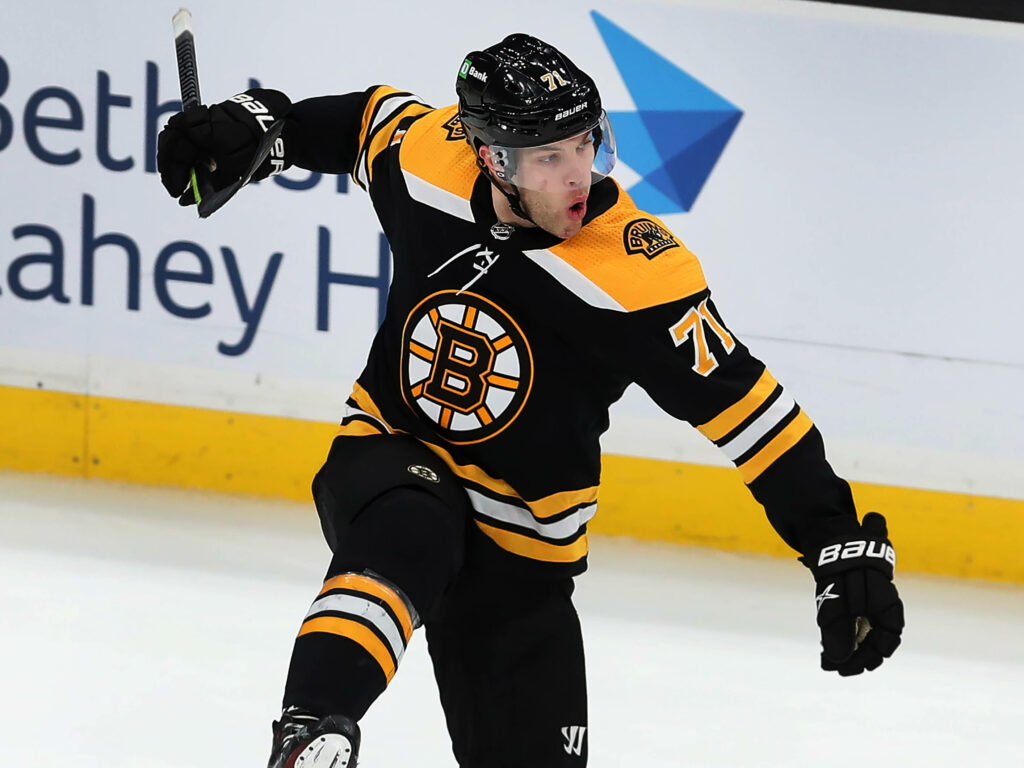 Taylor Hall Boston Bruins celebrating on ice vibrant NHL hockey wallpaper background