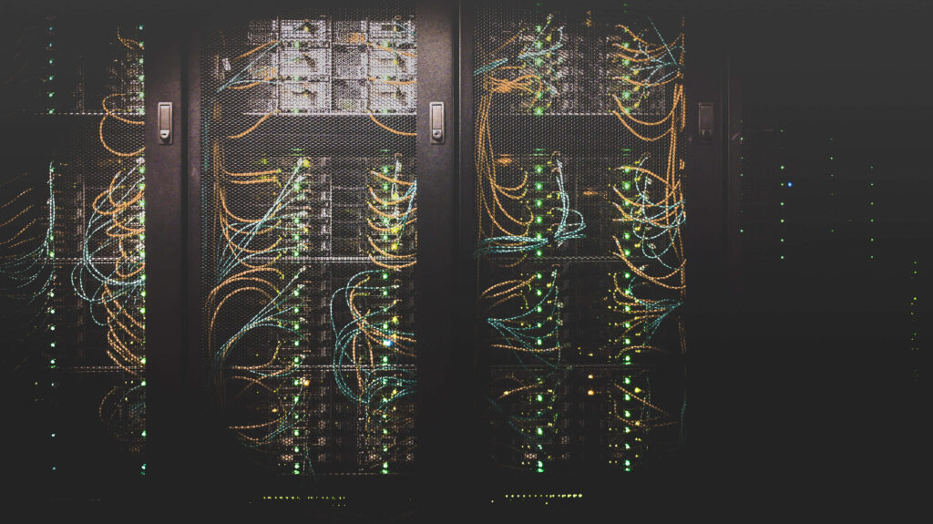 Dynamic Tech Wallpaper: Illuminated Data Center & Server Racks