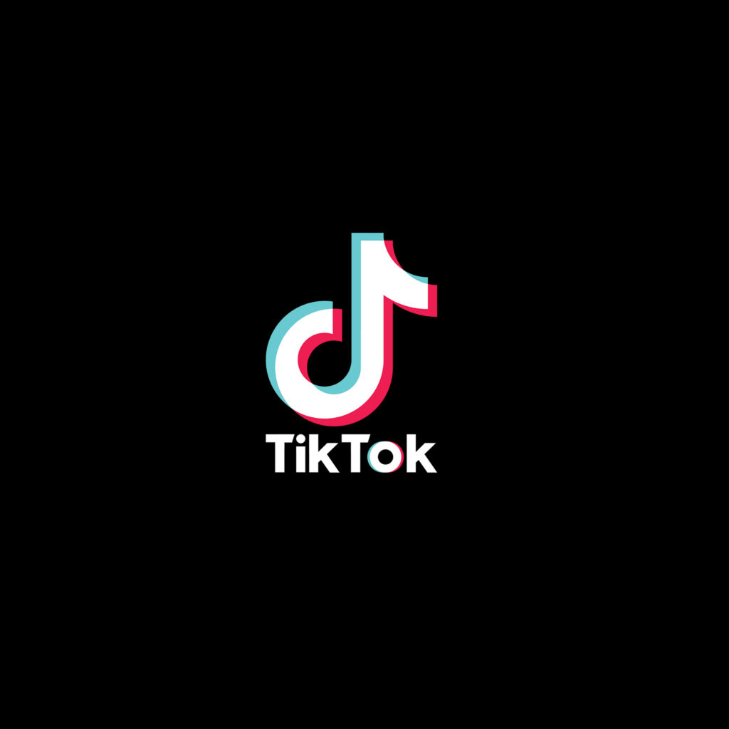 Bold TikTok logo with vibrant paint splashes on black background modern TikTok wallpaper