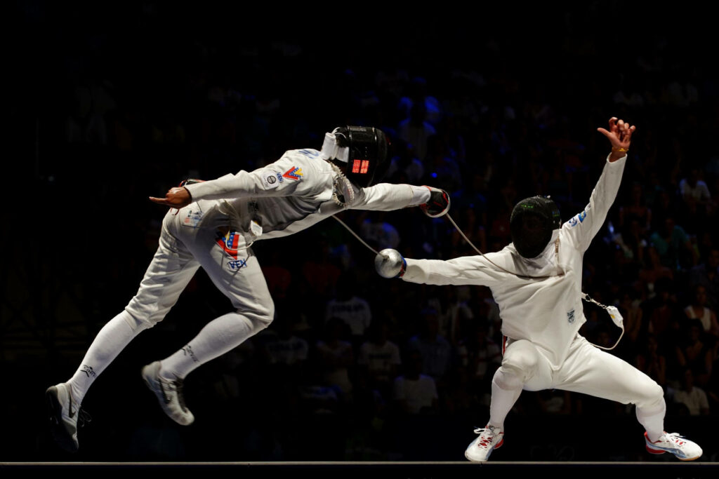 Dynamic USA Olympic Fencers Wallpaper: Intensity of Modern Pentathlon
