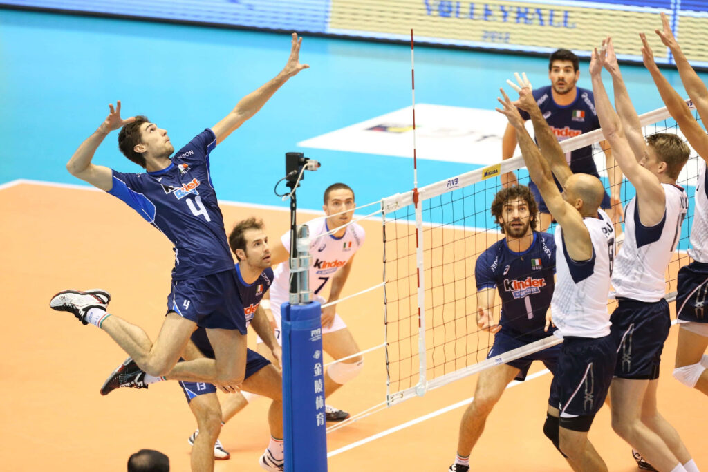 Dynamic Volleyball Match Wallpaper: Teamwork in Blue and White