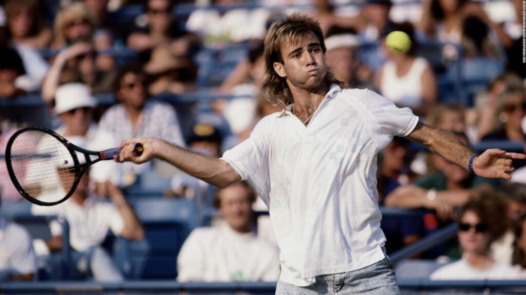 Andre Agassi Mid-Action: Dynamic Tennis Wallpaper Background