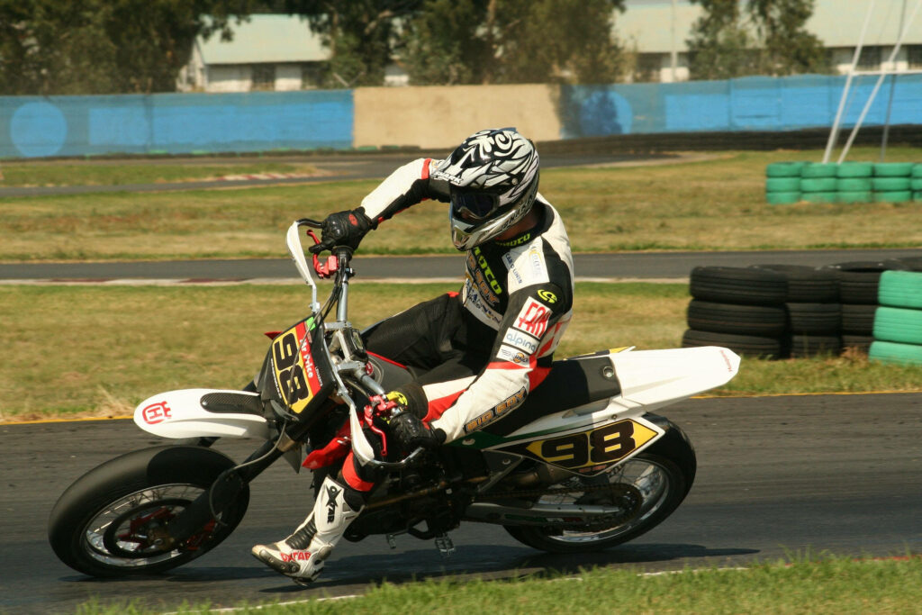 Dynamic Bike Rider Wallpaper: Speed & Control on the Race Track