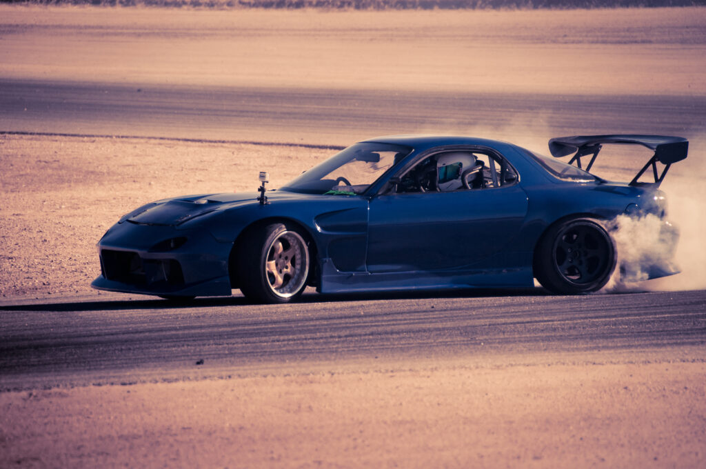 High-Speed Blue Mazda RX-7 Drift Wallpaper: Motorsport Thrill