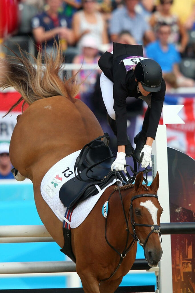 Dynamic Equestrian Wallpaper: Modern Pentathlon Rider Falls Off Horse