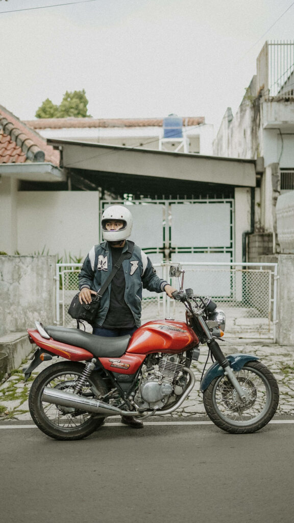 Dynamic Red Motorcycle Wallpaper: Adventurous Rider in Serene Scene