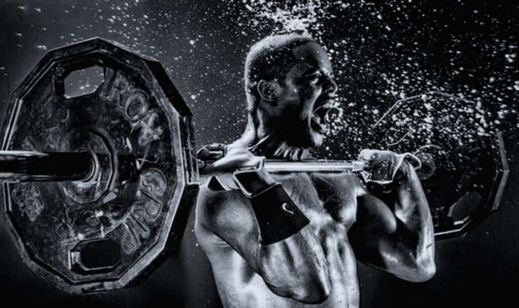 Dynamic Black & White Wallpaper: Man Lifting Weights in Intense Energy
