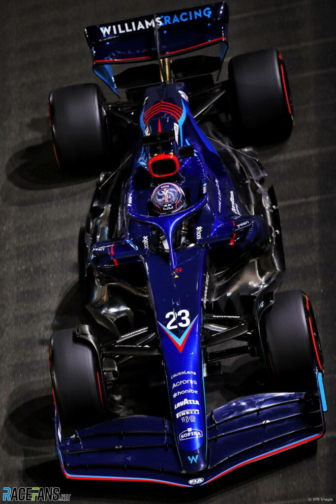 Dynamic Blue Williams Racing Car 23 Wallpaper Under Vibrant Lighting