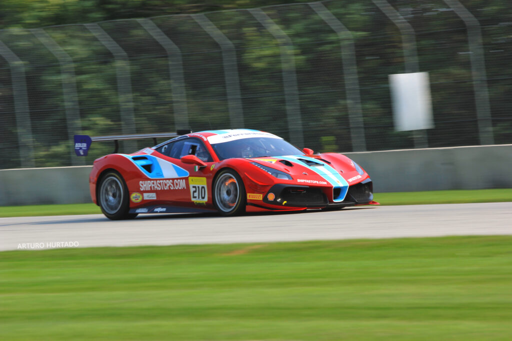 Vibrant Red Sports Car Racing Wallpaper - Speed and Performance