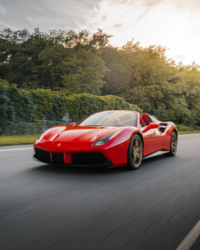 Stunning Ferrari 458 in Motion: Dynamic Wallpaper & Lush Background