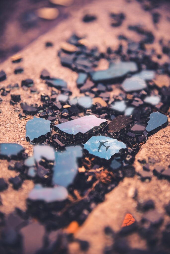 Shattered Glass Wallpaper: Plane Silhouette Reflected in Unique Design