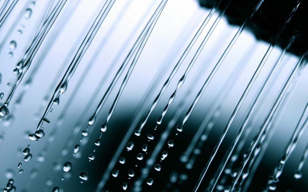 Dynamic Water Drops Wallpaper: Refreshing Flow in Close-Up