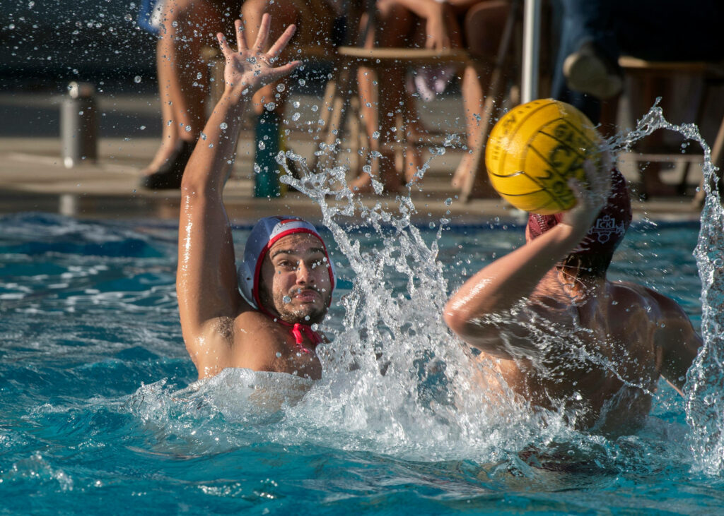 Intense Water Polo Wallpaper: Athletes in Action & Splashing Water