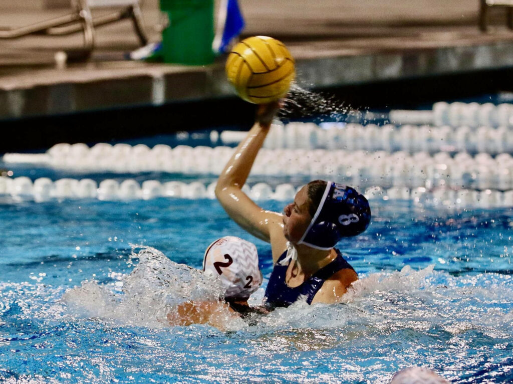 Dynamic Women's Water Polo Practice: Intense Gameplay Wallpaper