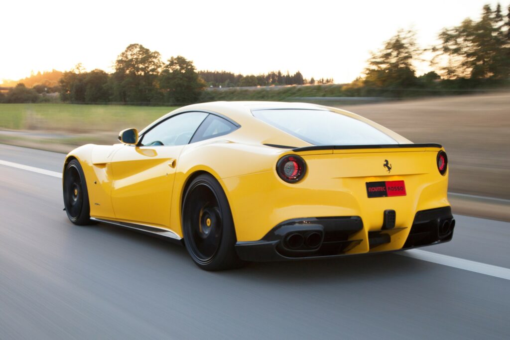 Dynamic Wallpaper: Yellow Ferrari F12 Speeding Down Open Road