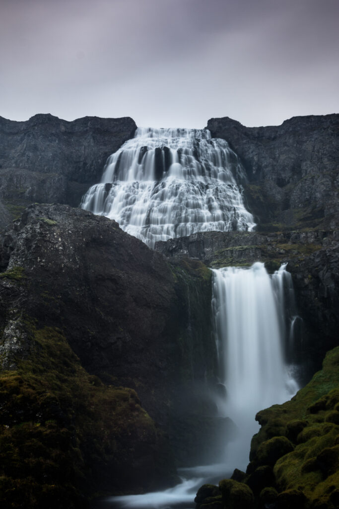 Dynjandi Waterfall Iceland cascading white streams rugged rocks green moss dramatic cloudy sky wallpaper