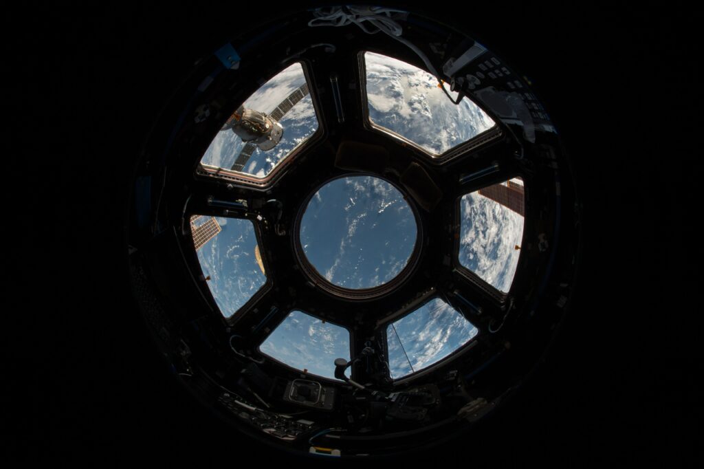 Breathtaking Earth View from Space: Unique Porthole Wallpaper Background