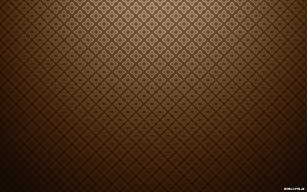 Brown damask wallpaper with intricate coffee-hued pattern and subtle vignette lighting background