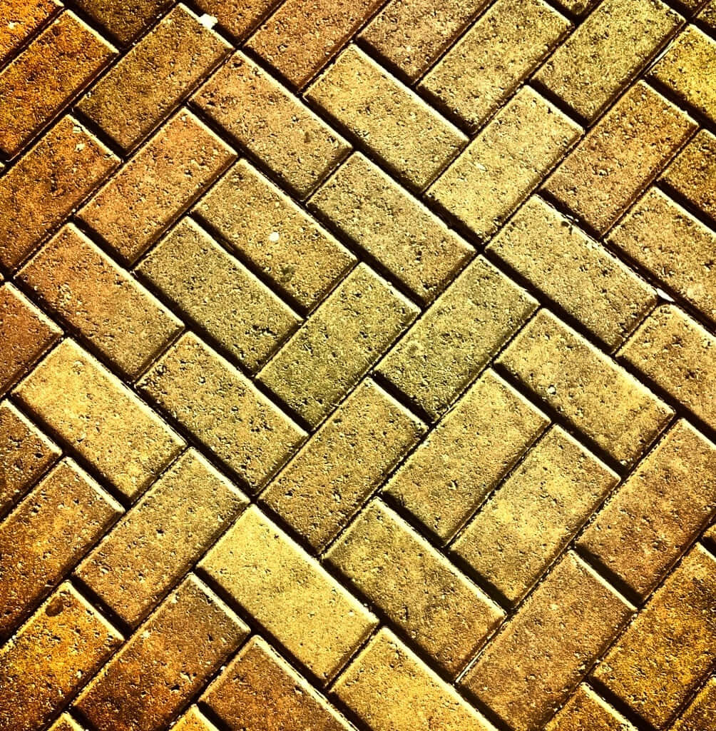 Earthy Brick Herringbone Wallpaper Background - Textured Design