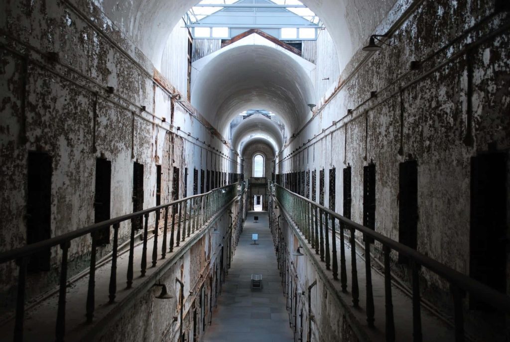 Eastern State Penitentiary abandoned cell block with barrel-vaulted ceiling and decayed walls Wallpaper
