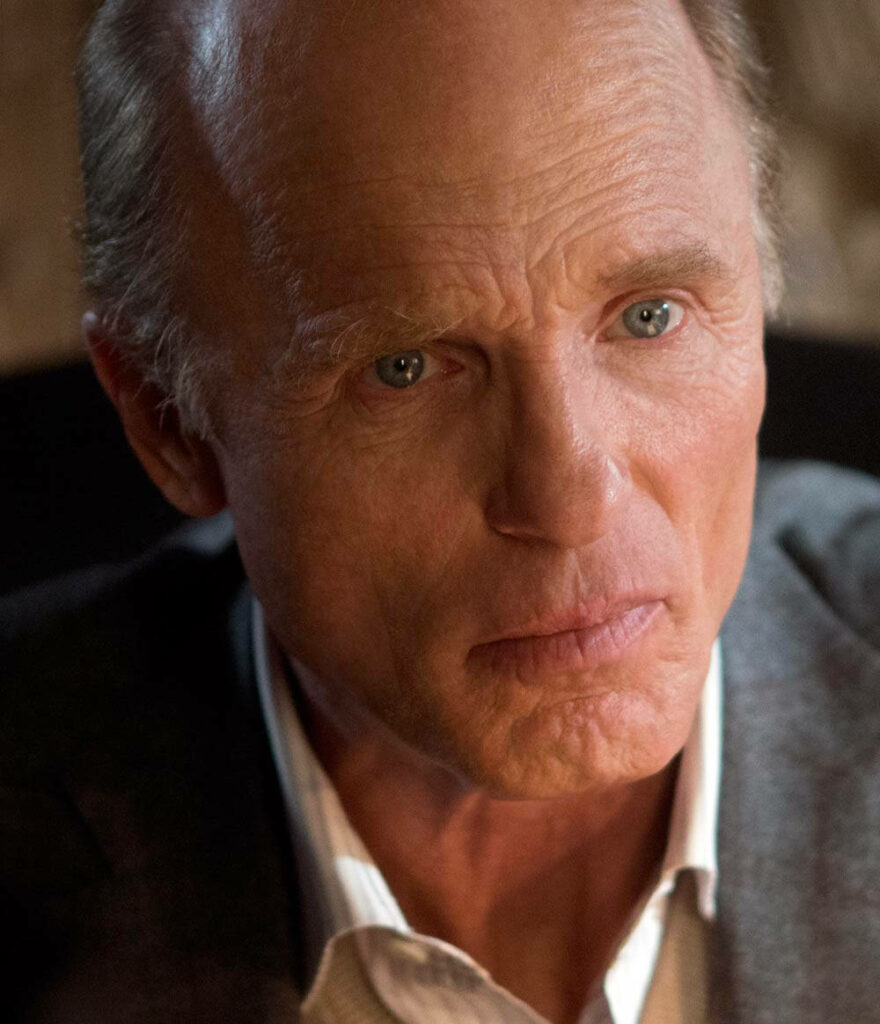 Ed Harris close-up intense expression Run All Night dramatic lighting deep blue eyes gritty tone Wallpaper