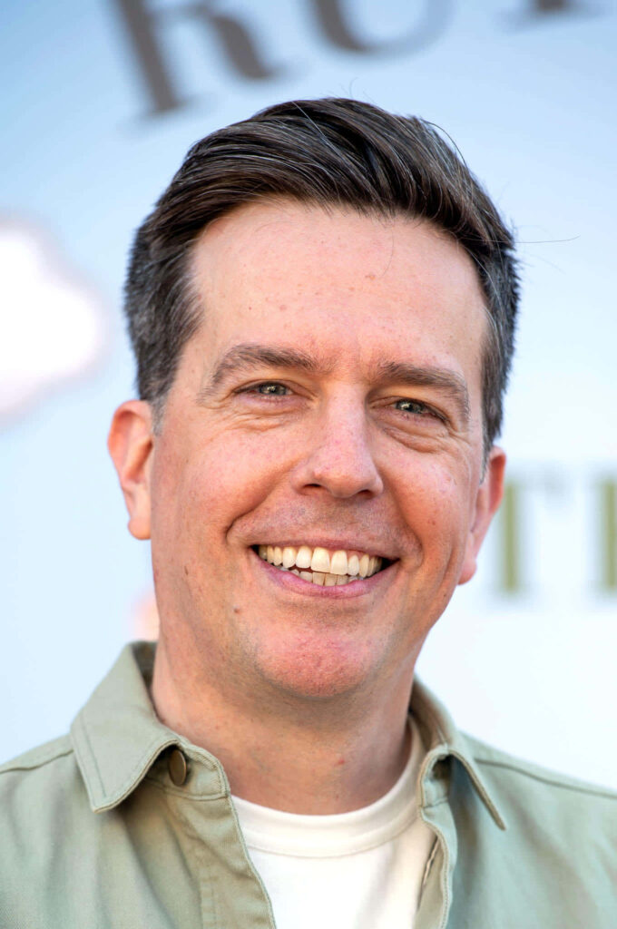 Ed Helms close-up portrait smiling casual light shirt warm natural lighting wallpaper background