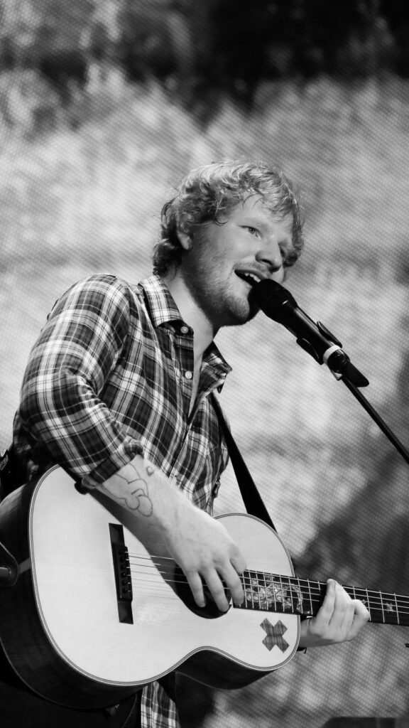 Ed Sheeran's Passionate Guitar Performance: Black & White Wallpaper