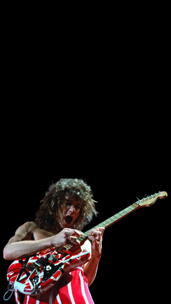 Eddie Van Halen playing red white striped guitar in energetic live rock performance wallpaper