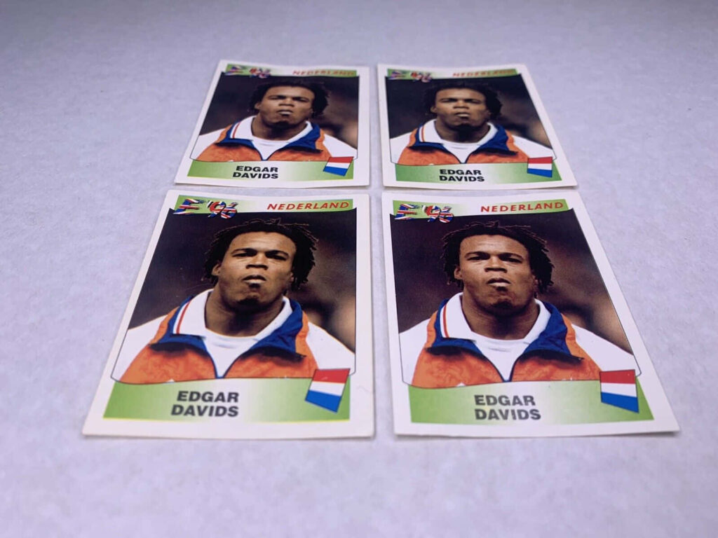 Closeup of Edgar Davids football card with Dutch orange colors and iconic dreadlocks wallpaper